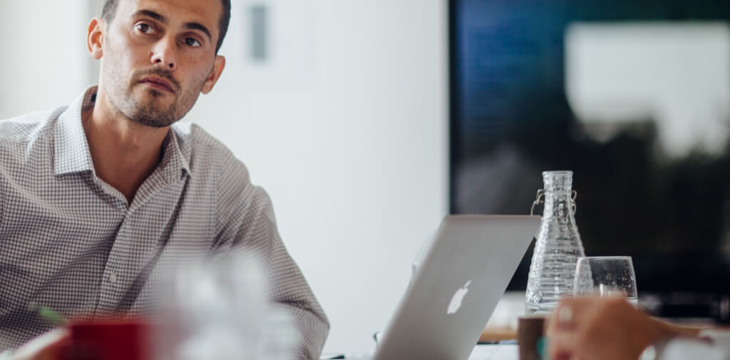 man at desk with laptop